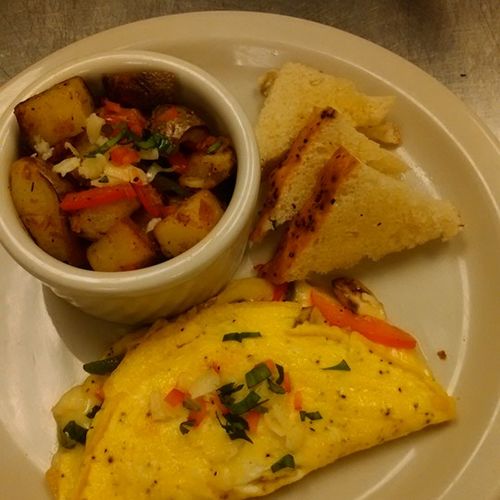 Denver omelet with roasted potatoes and toast.