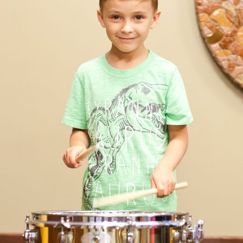 Henry P. on the snare drum. Age 7