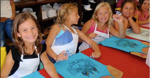 Having fun at a t-shirt painting party.