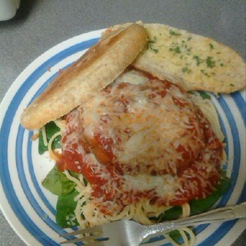Chicken Parmesan on a bed of Spinach and Garlic Br