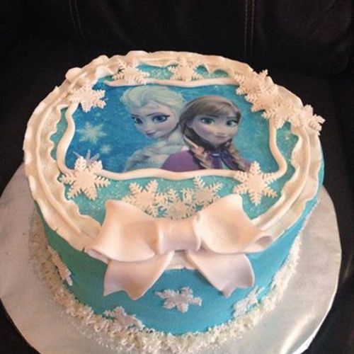 Frozen theme cake with image, buttercream, and fon