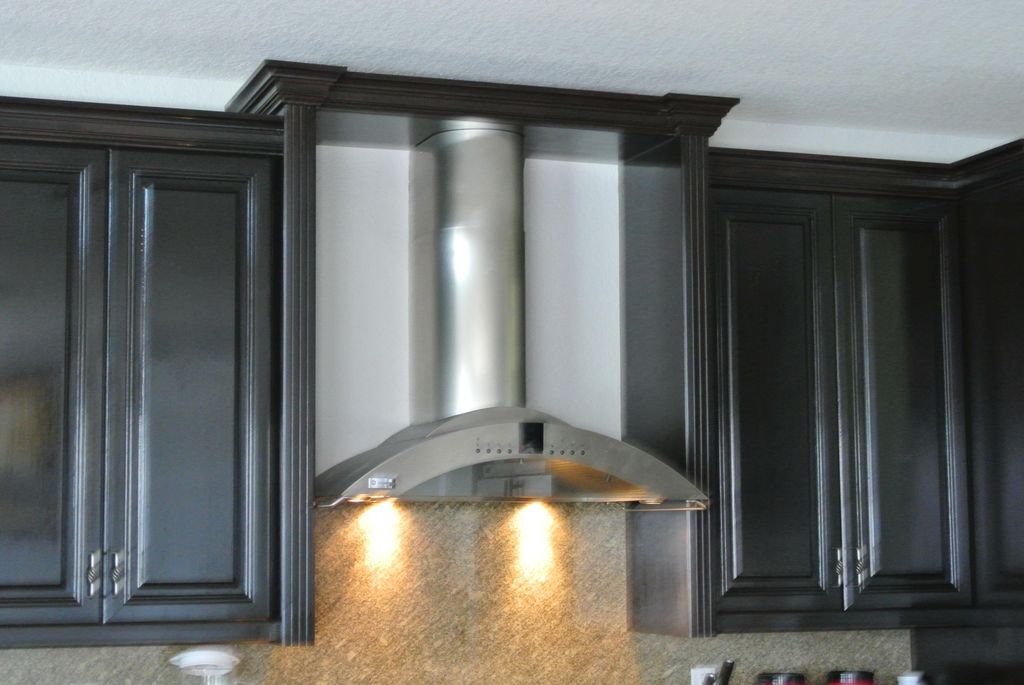 Kitchen Cabinet refinishing in Faux Wood .