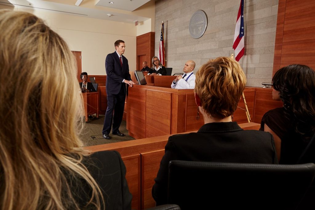 Discussing an injury with doctor at trial.
