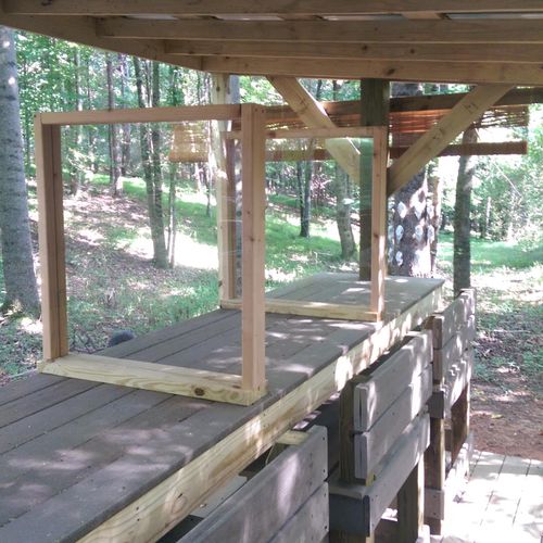 Outdoor pistol range with table, benches and parti