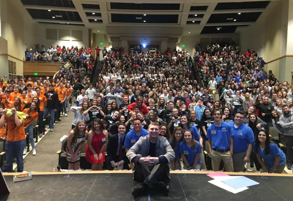 John in front of a crowd