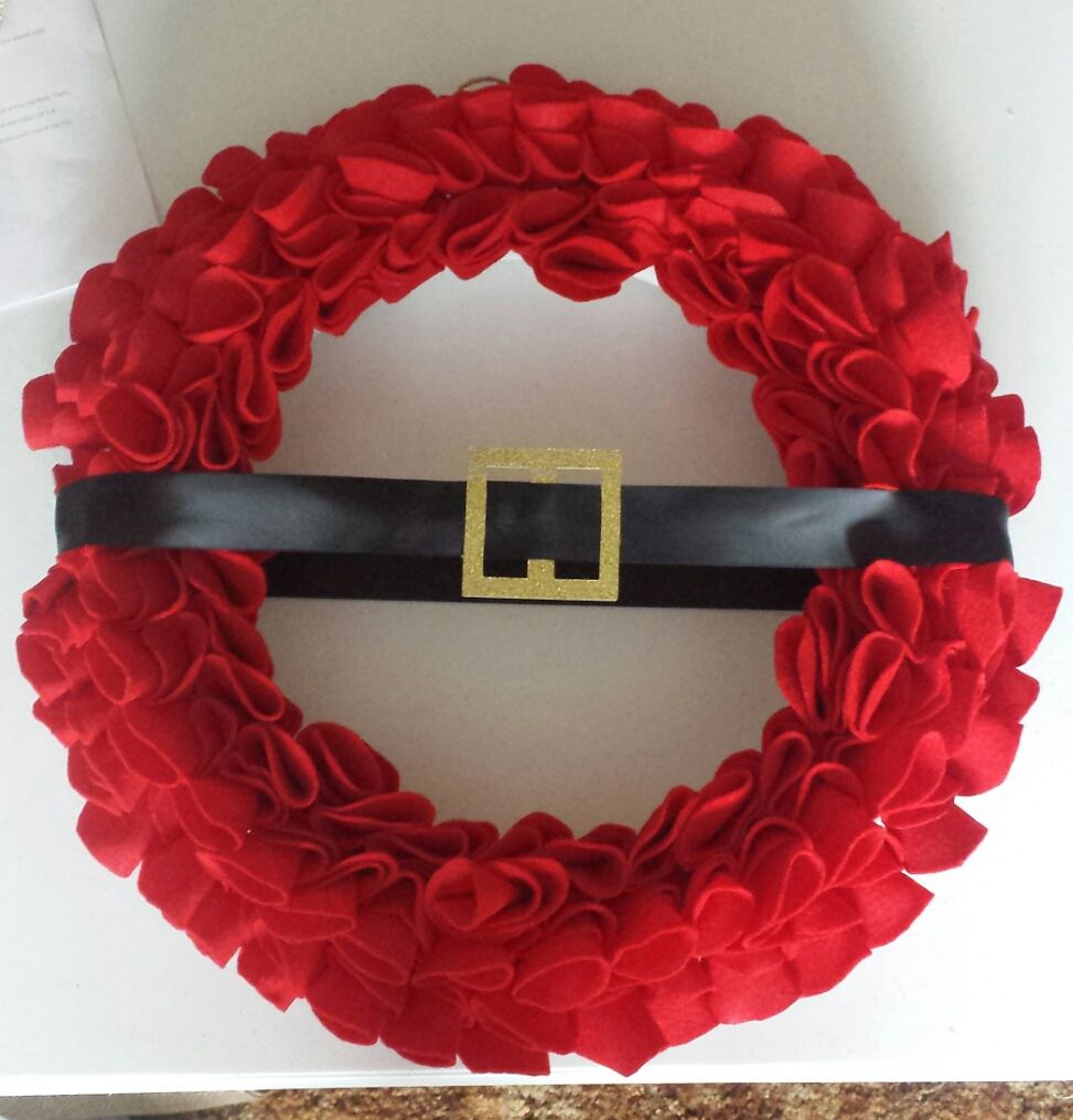 Christmas wreath made out of felt.