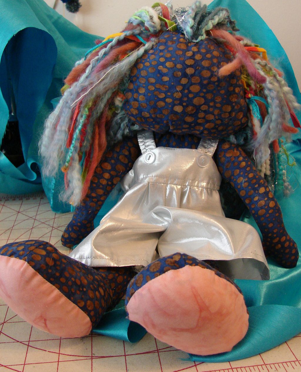 Handmade doll, about 18". Hair of yarns and metall