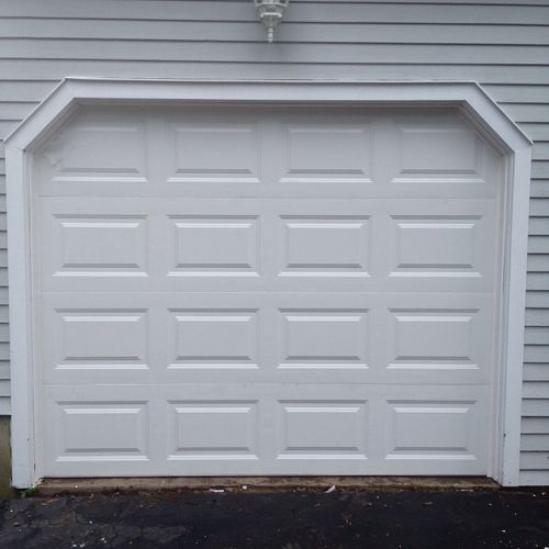 Raised panel steel insulated garage door