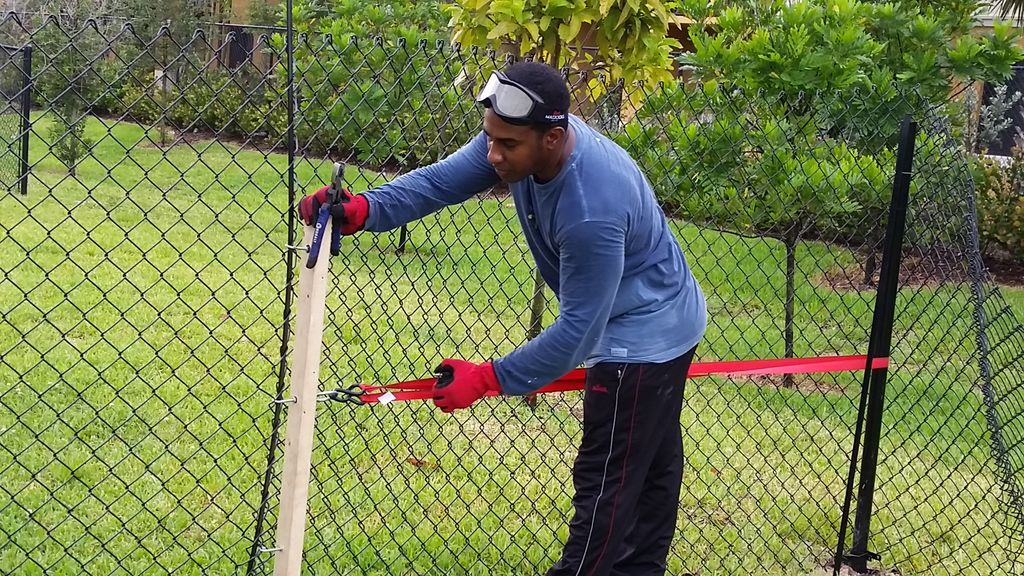 1430' of Black chain link fence installation in Mi