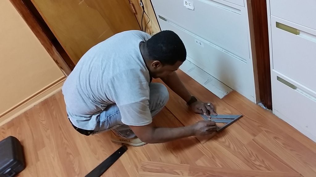 Laminate flooring throughout 1600 sq ft office rem