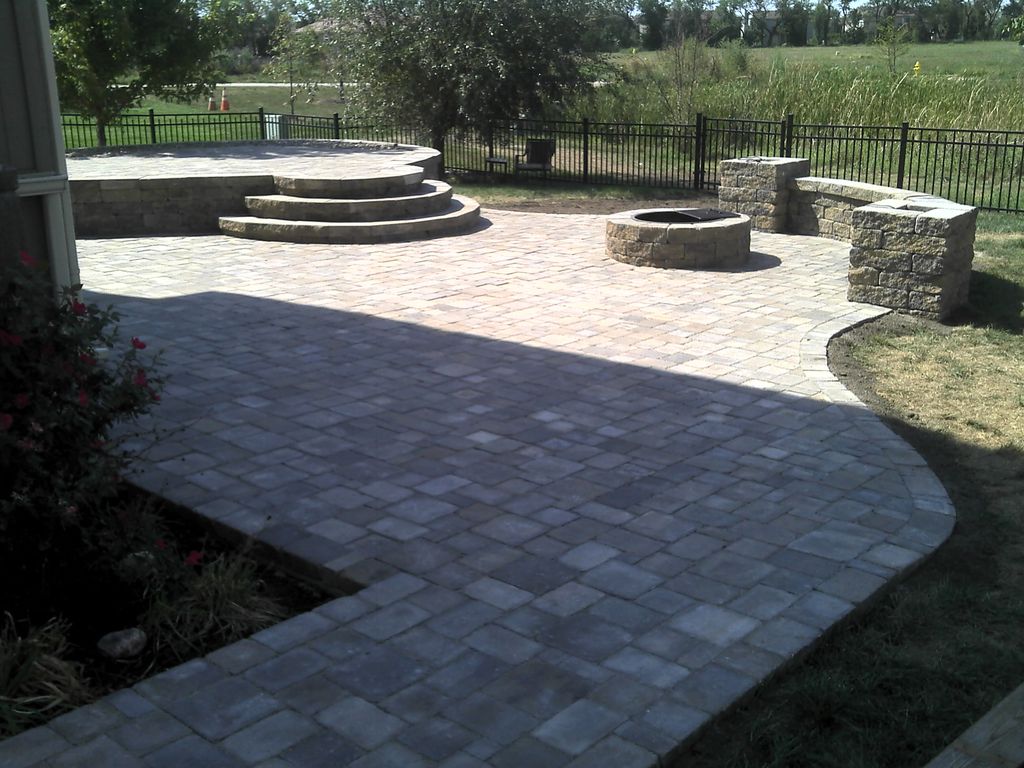 Firepit, seat wall, two tiered patio, and planting