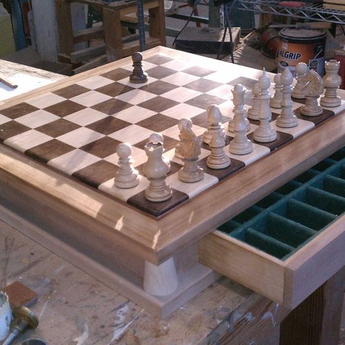 Custom made chess board and pieces from Walnut, ma
