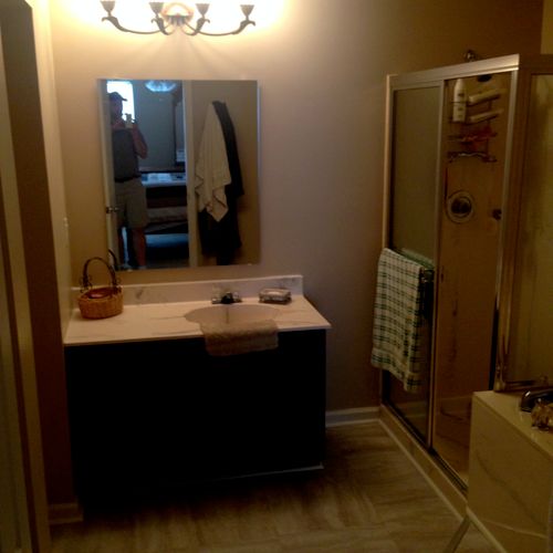 New Bathroom flooring, mirror, and vanity refinish