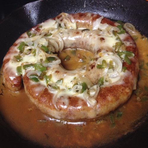 Homemade sausage ring, sauteed with green peppers,