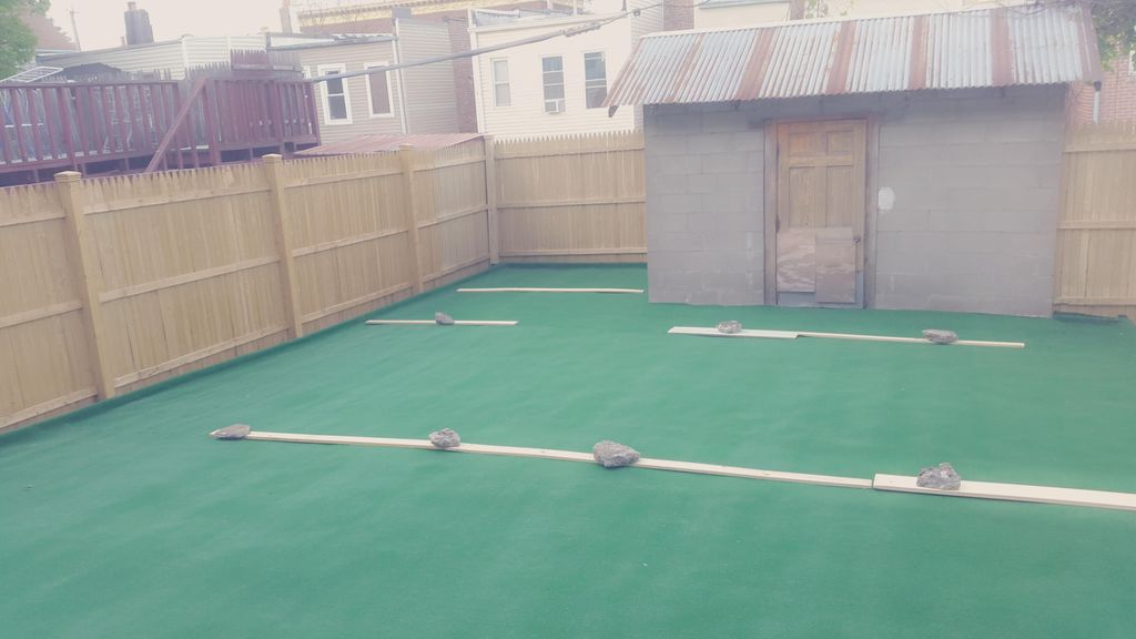 Out door carpet and fencing in the backyard patio