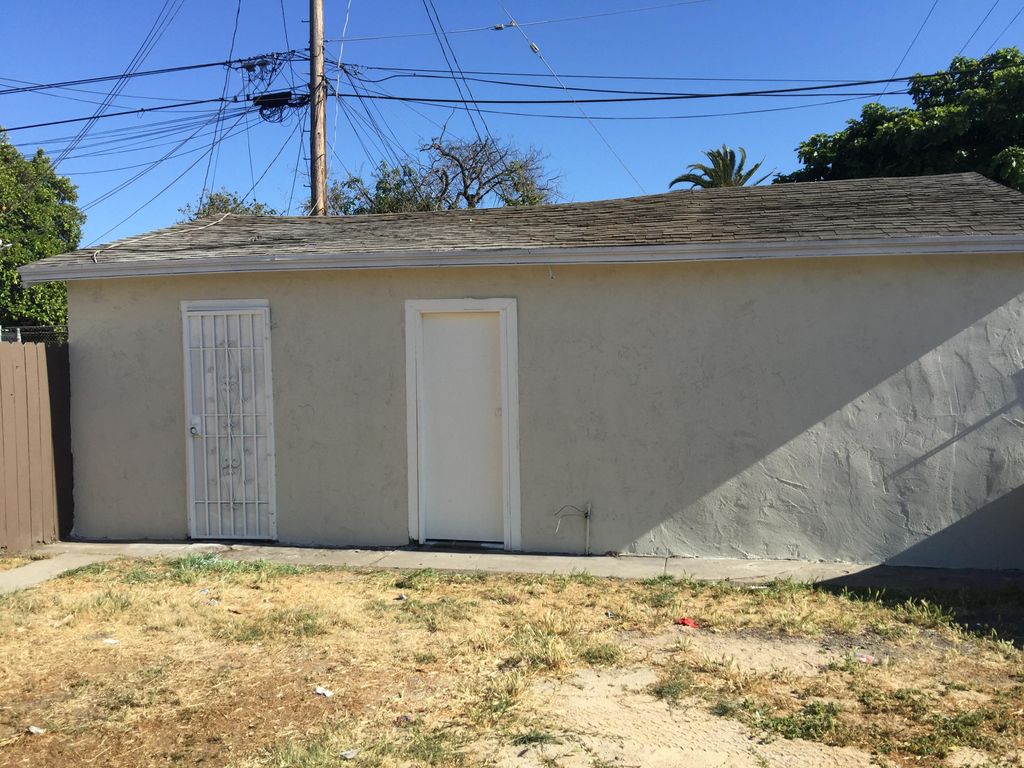 Side look for new garage paint with door and trims
