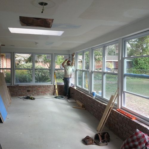 Remodel turning damaged porch into sun room