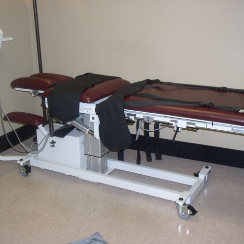 Spinal decompression table to treat  low back pain