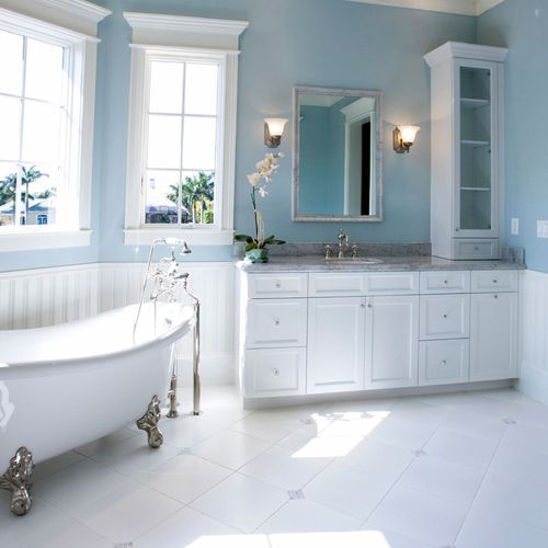 Powder blue walls, with white trim and ceiling.