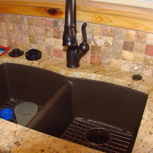 Installation of deep dish sink and facet.