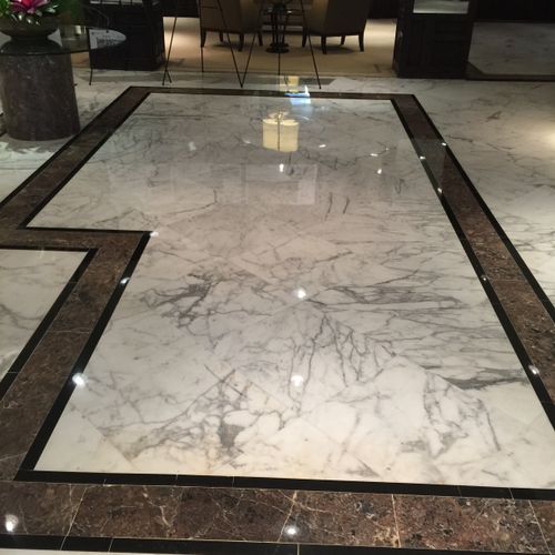 Calcatta marble floors with chocolate
marble inlay