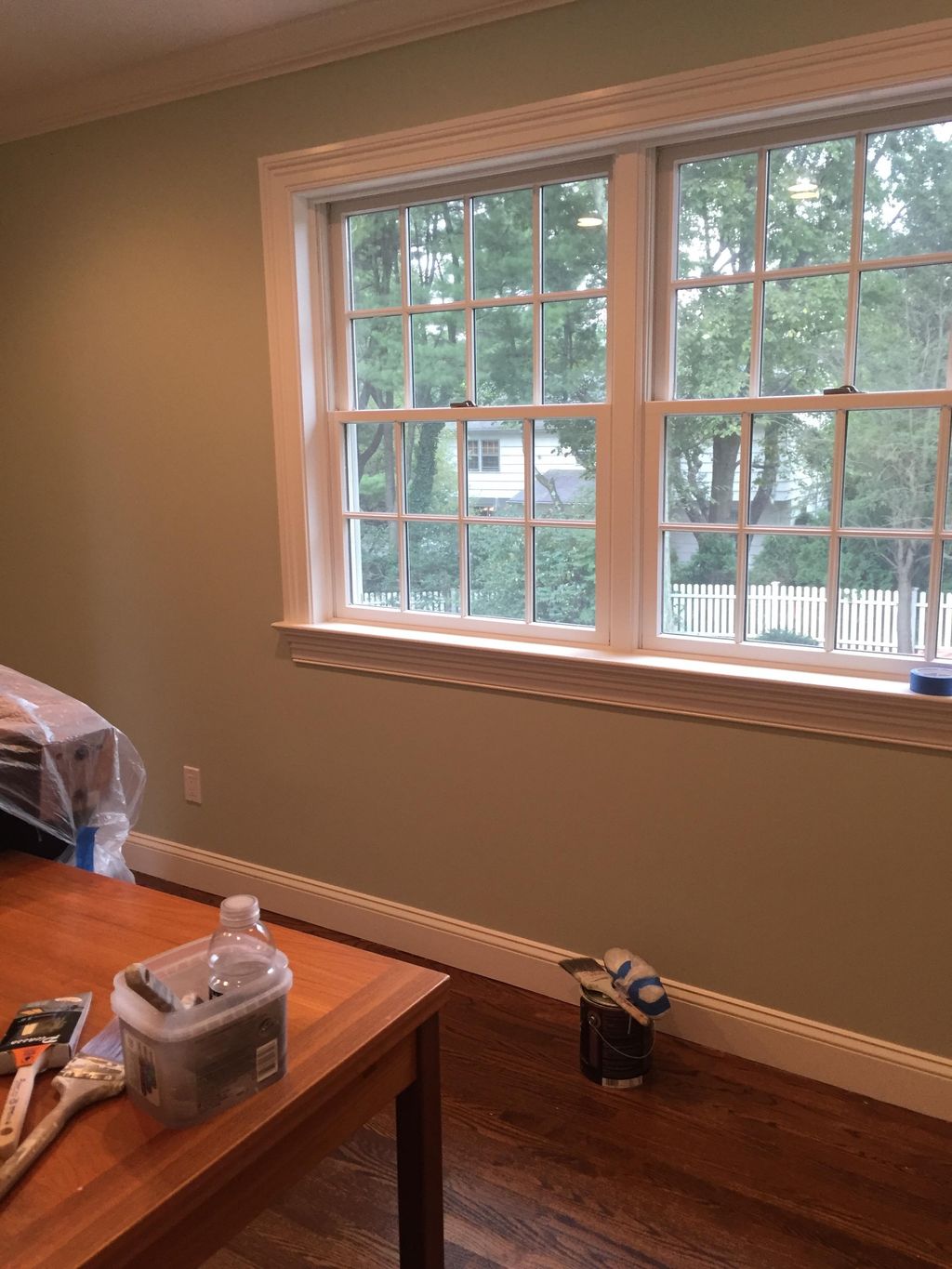 Finished interior wall with window trim.