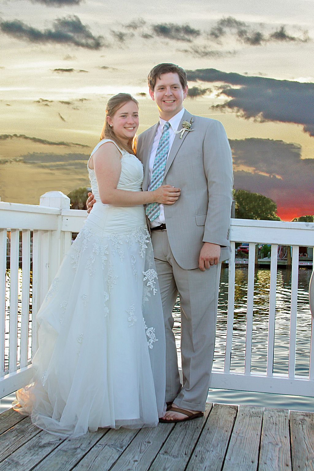 Enhanced sunset sky with bride and groom. Actually