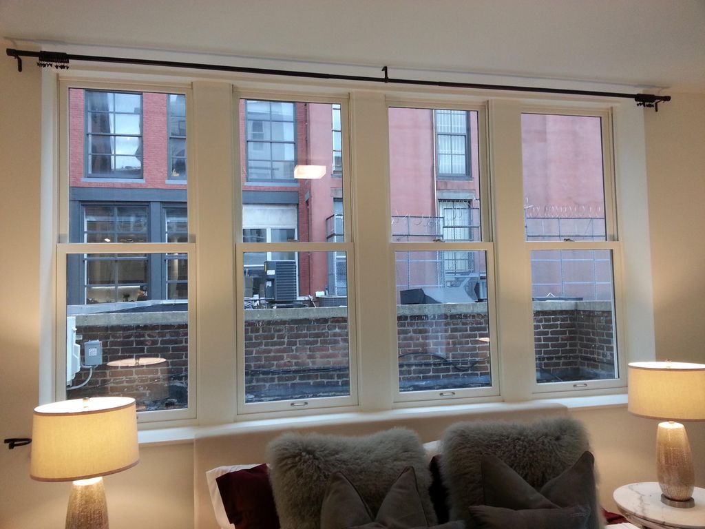 Curtain rod over wide window.