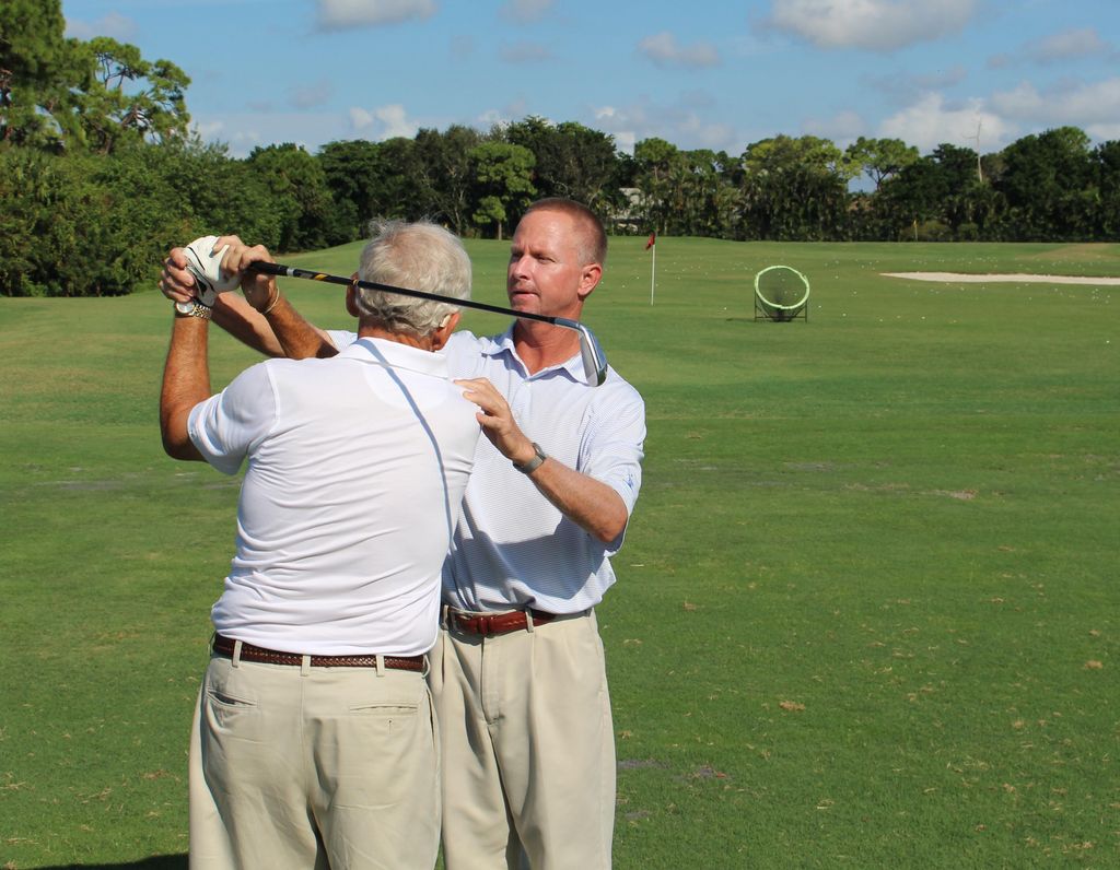 Working with a client at Pelican's Nest Golf Club