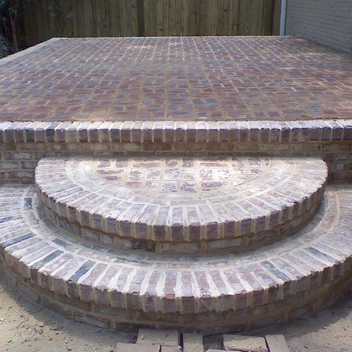 brick patio with round stairs