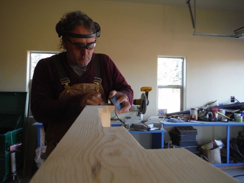 sanding up the furniture in the shop.