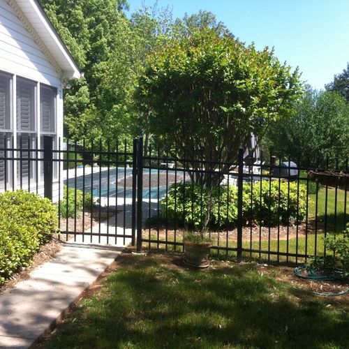 Black aluminum fence with self closing gates