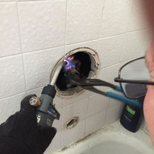 Working in a tight spot install a new shower valve