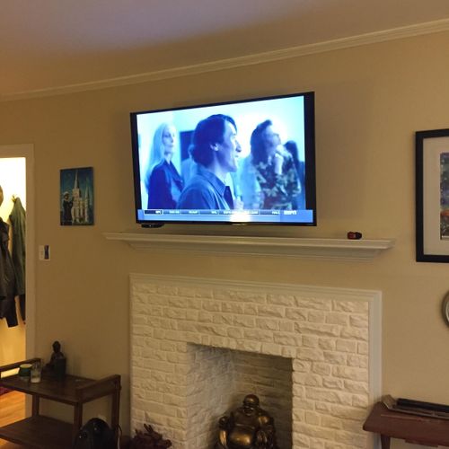 55" TV mounted with articulating swivel mount abov