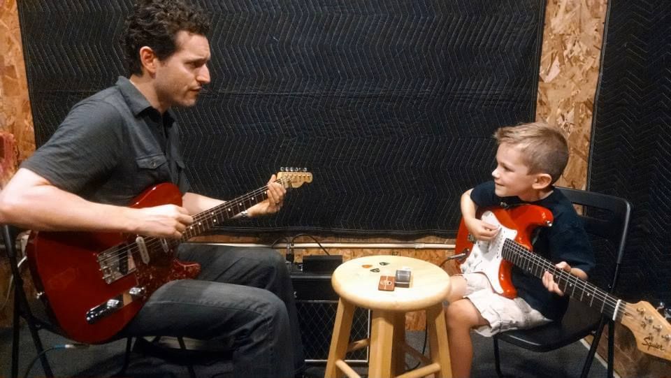Our rockstar Luke at his first Guitar Lesson with 