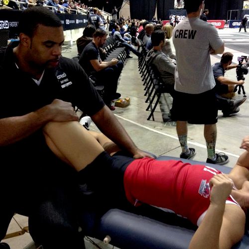 Stretching an athlete during the National Pro Grid
