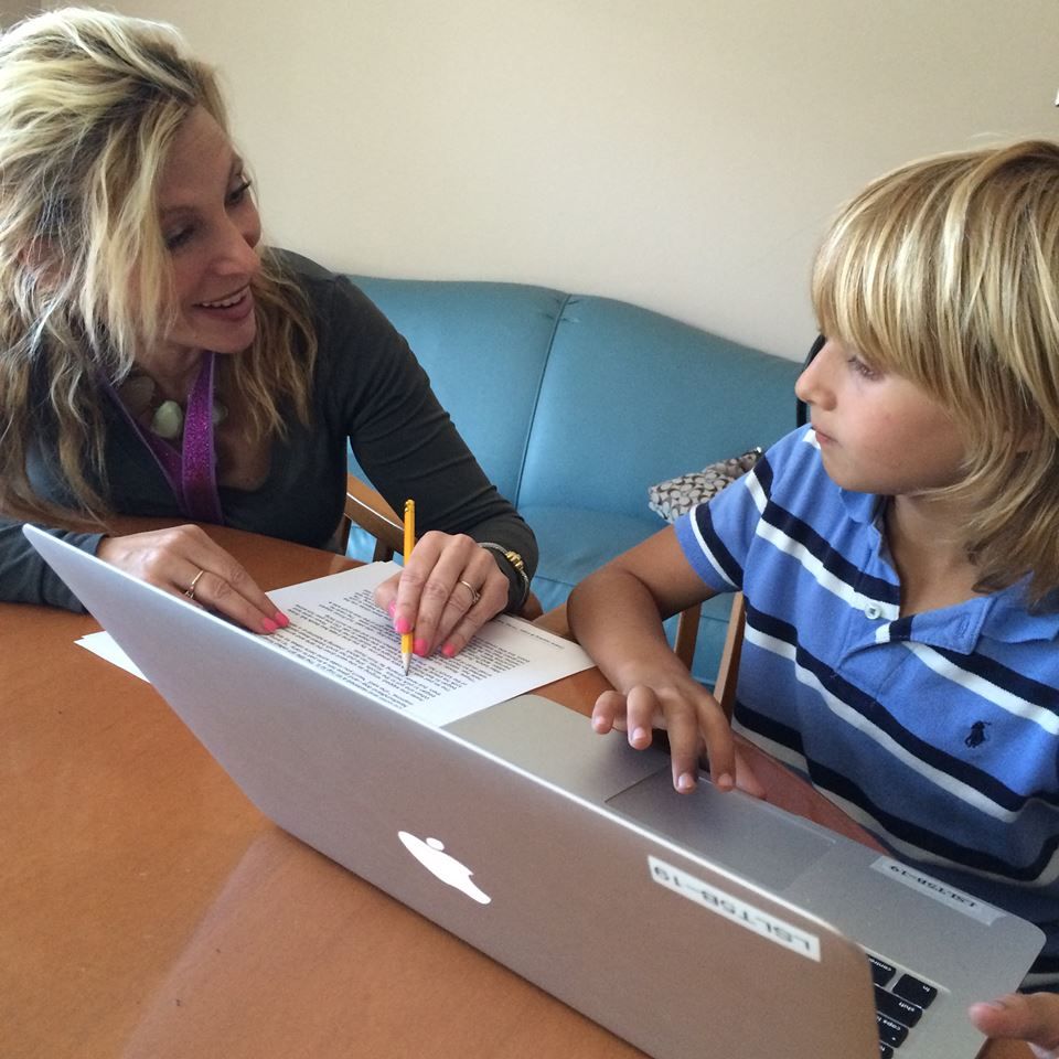 Using the computer to work on reading strategies.