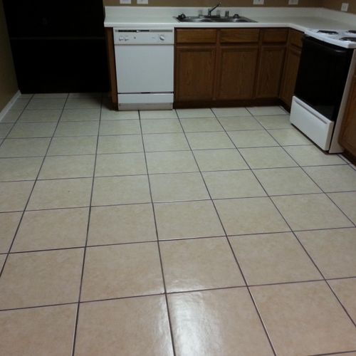 Tile floor installed in kitchen and dining room.