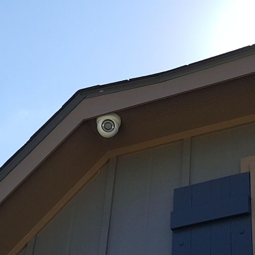 motorized camera on the outside of a house