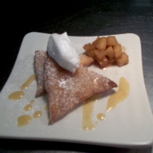 fried dough with a caramelized apples and whipped 