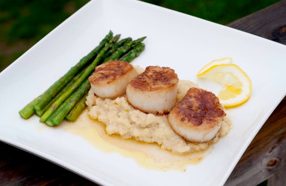 Seared Scallops over a creamy risotto topped with 