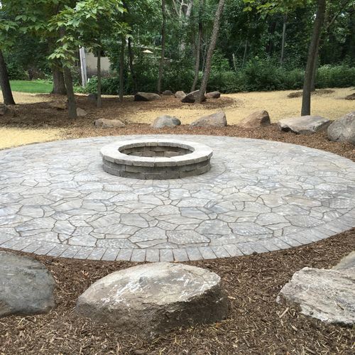 Circular paver patio with fire pit.