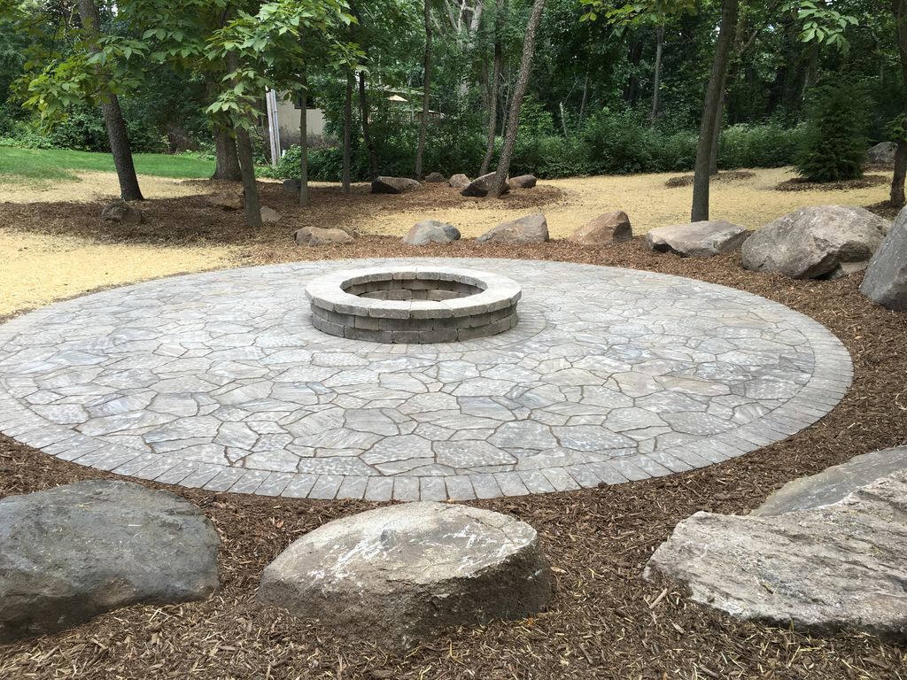 Circular paver patio with fire pit.