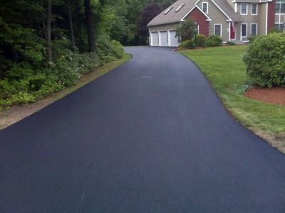 freshly paved asphalt driveway with 2 year guarant
