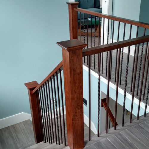 Custom cherry handrails with metal balusters. 
