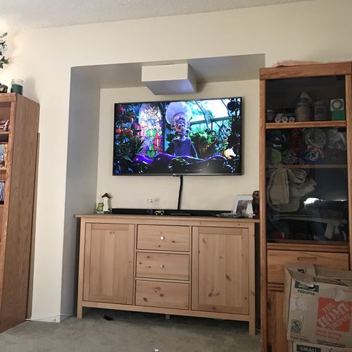 New flat screen mounted and IKEA entertainment cen