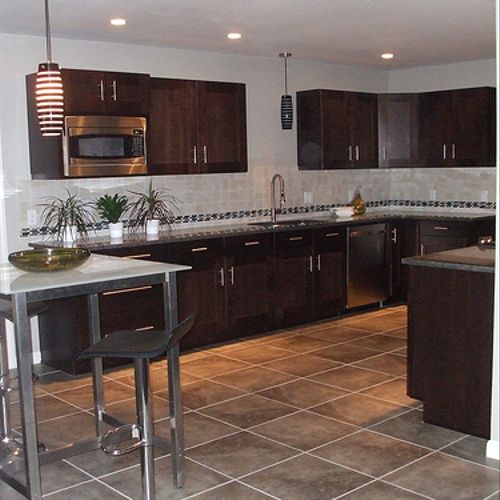 This  is a kitchen and floor . tile and backsplash