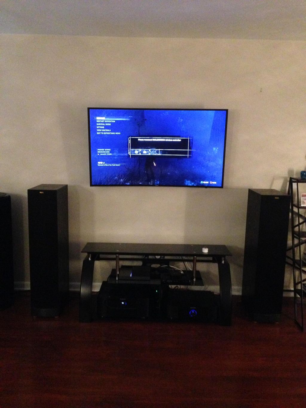 55" curved TV mounted/Apple TV, PS4, modem, Cable 