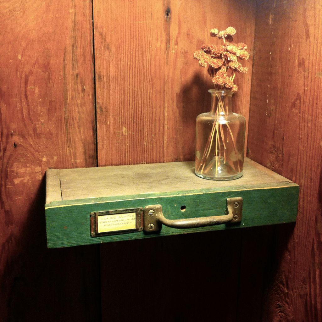 This shelf is made from a found drawer front; I pa