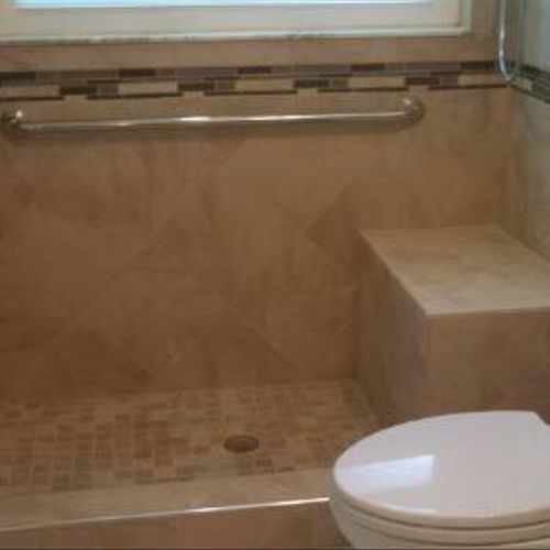 Remodeled bathroom with inlayed tile border and sh